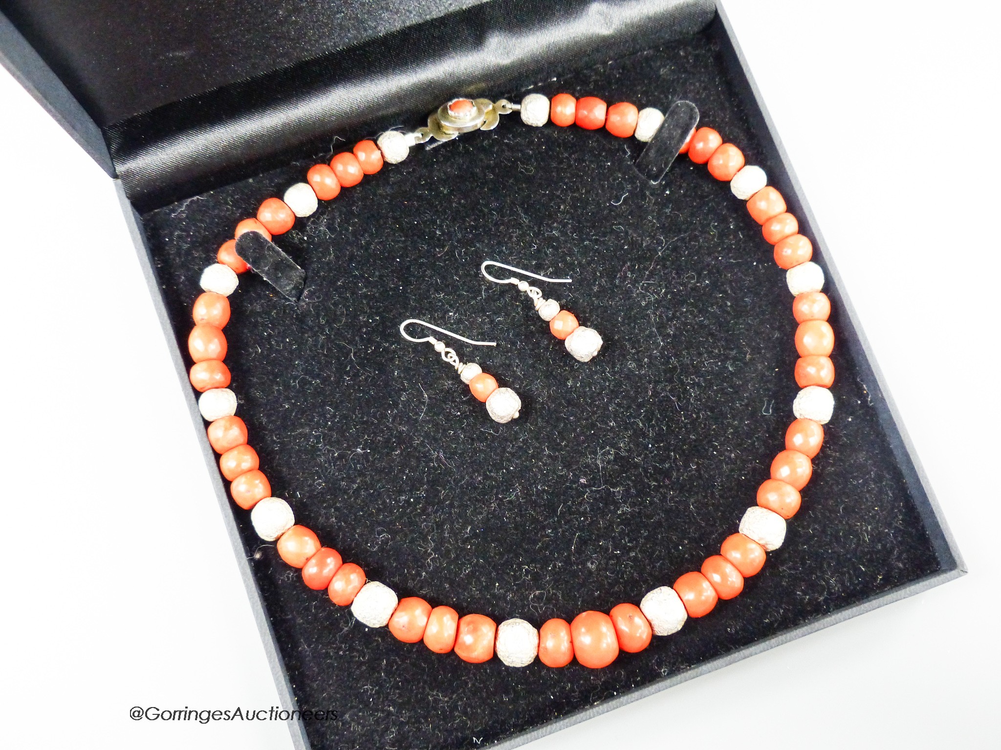 A modern Pruden Smith coral and white metal bead necklace, approx. 42cm and a pair of matching drop earrings